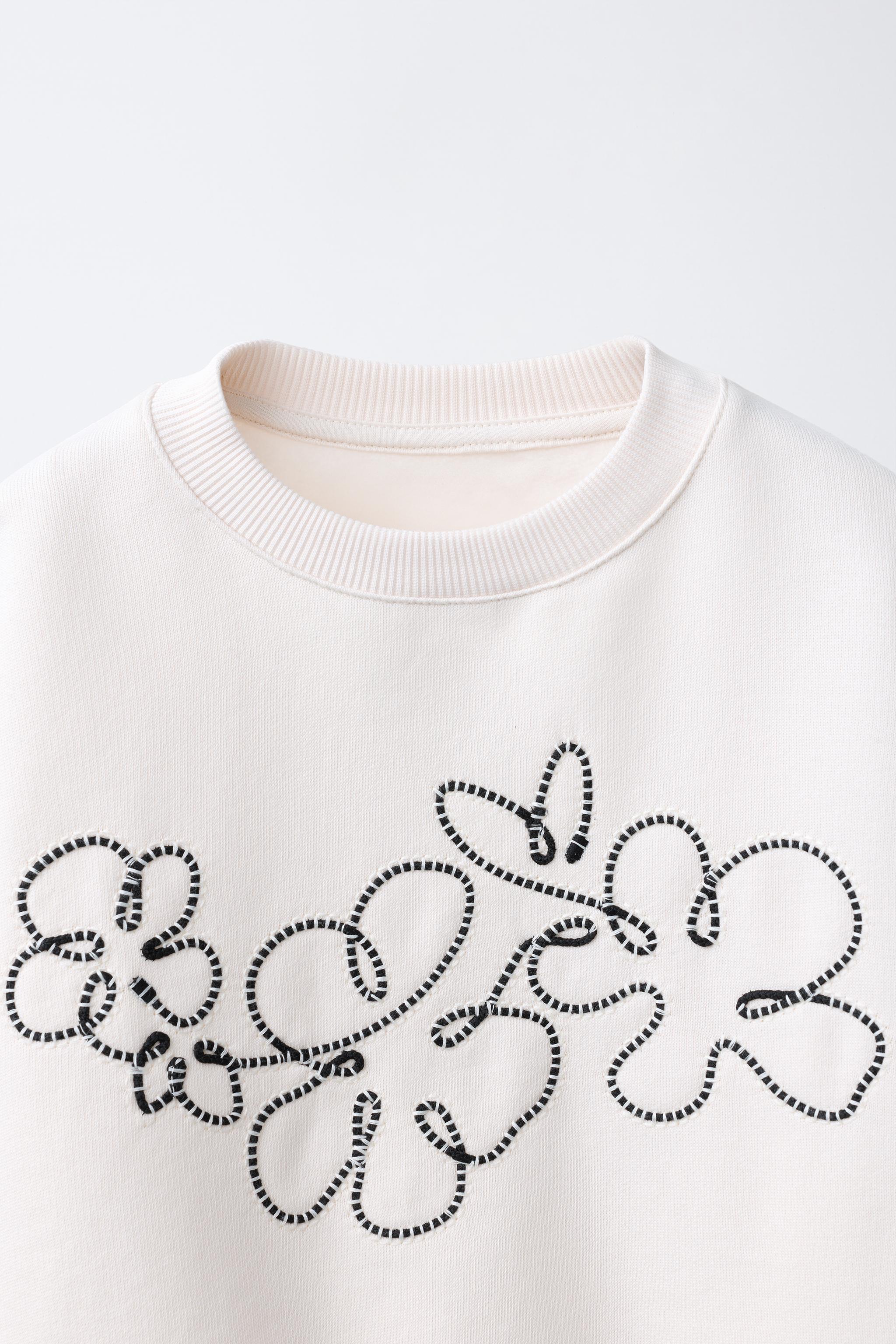 DRAWSTRING FLOWER SWEATSHIRT